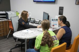 David Ross staff talking with a patient