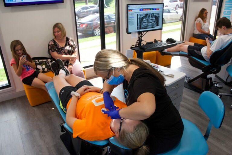 David Ross staff working with a patient