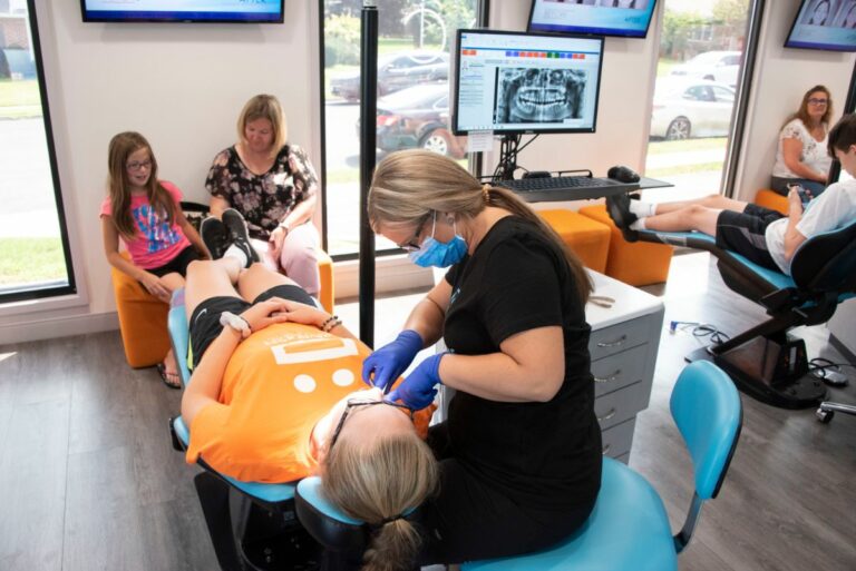 David Ross assistant working on patient's teeth